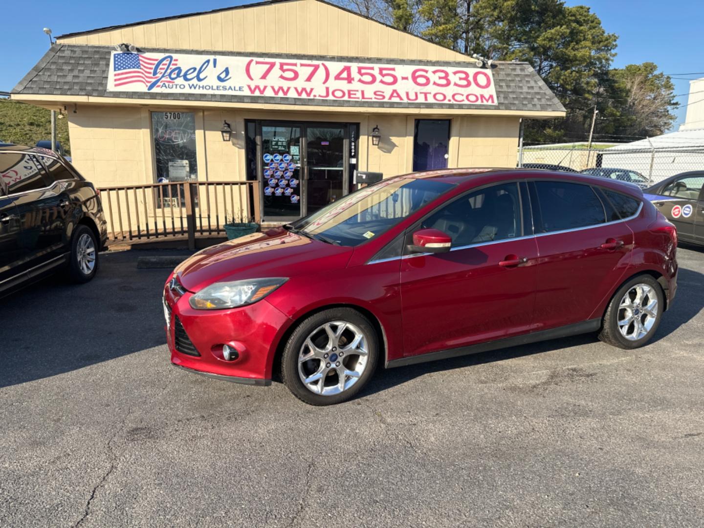 2014 Burgundy Ford Focus (1FADP3N23EL) , located at 5700 Curlew Drive, Norfolk, VA, 23502, (757) 455-6330, 36.841885, -76.209412 - Photo#0